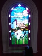 Stained glass window at White Ibis Hotel.